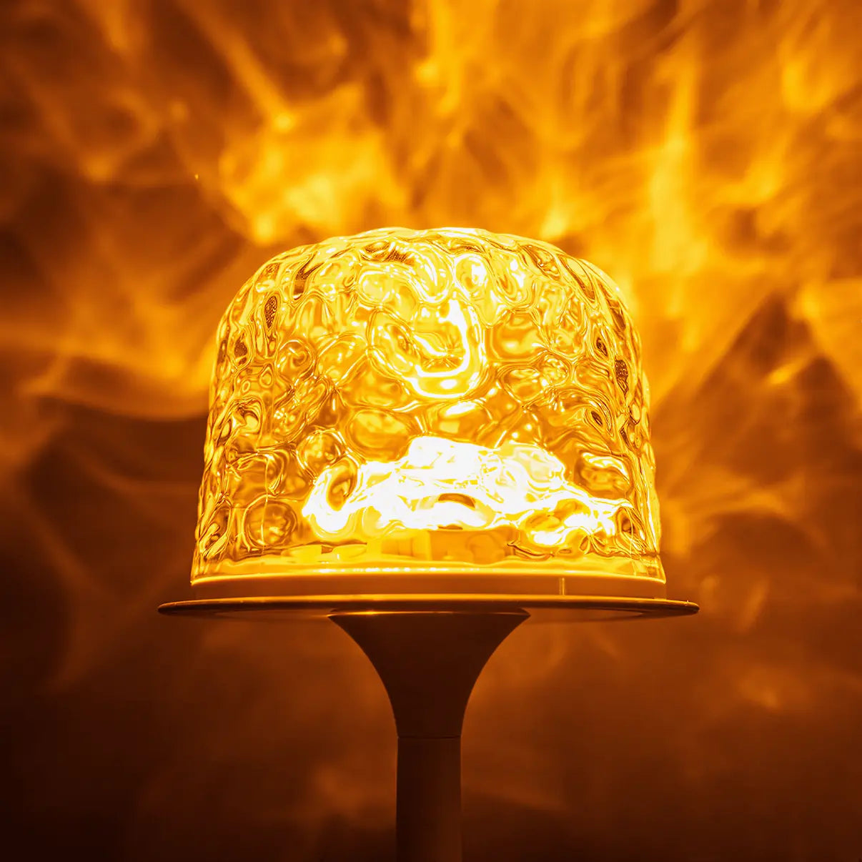 Close-up of witlity skywave lamp's rippled ice-crack glass shade, glowing with warm golden light. The intricate texture is magnified, casting flame-like flowing light patterns against a soft blurred orange background, creating a dreamy cozy atmosphere and highlighting the lamp's unique light art and transparent quality.